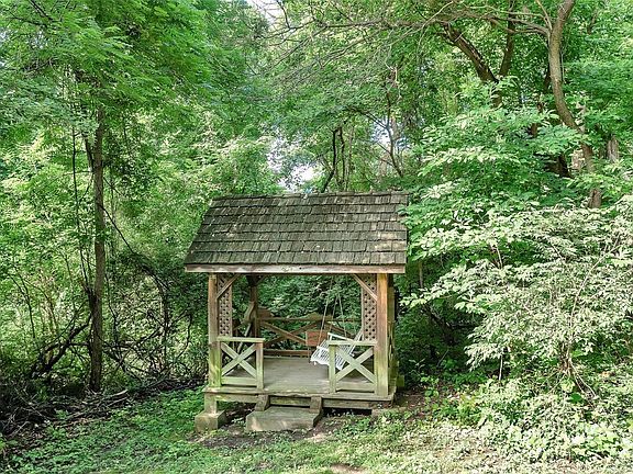 Enjoy the gazebo... tucked in the wooded back yard... alone or w/family & friends!