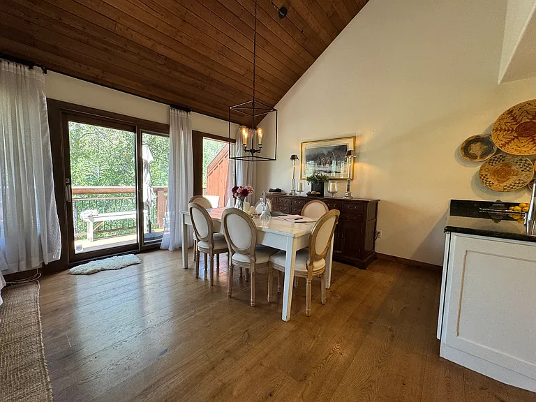 Dining Room next to the kitchen. Sliding door to the deck and views west toward the ski slopes and sunsets. Much lighter and brighter than these pictures show.