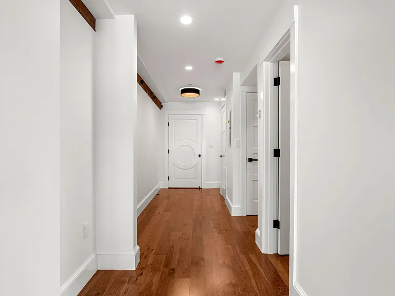 Entrance hall leading to Circular trimmed door