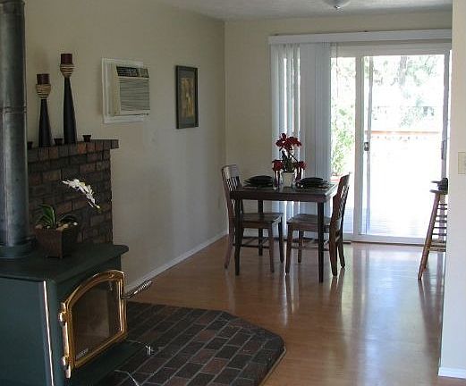 gorgeous dining area with a slider to the back deck