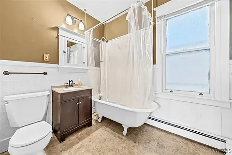 Vintage Clawfoot tub and vanity meet modern convenience with all new plumbing. Bathroom is very large and features a HUGE walk in storage closet for all of your linens and things!