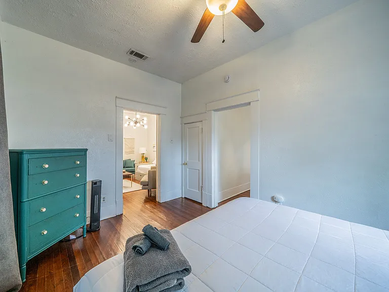 A thoughtfully designed bedroom with a seamless flow to the living area.