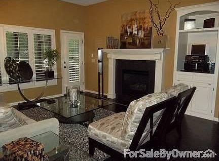 Living Room w/Fireplace
						:
						Enjoy 10'ft ceilings; built-in cabinets; ceiling speakers; gas fireplace.