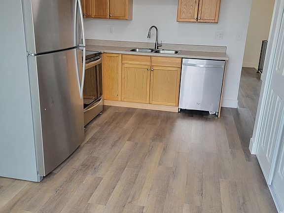 Kitchen view from Deck entrance stainless steel appliances, Pantry and eating space