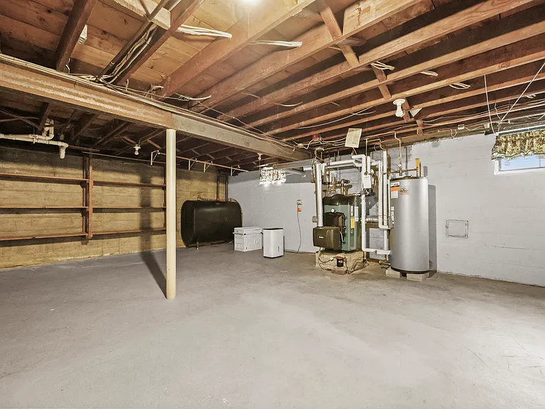Unfinished basement. Laundry and storage space.
