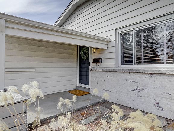 Charming front porch great for morning coffee.