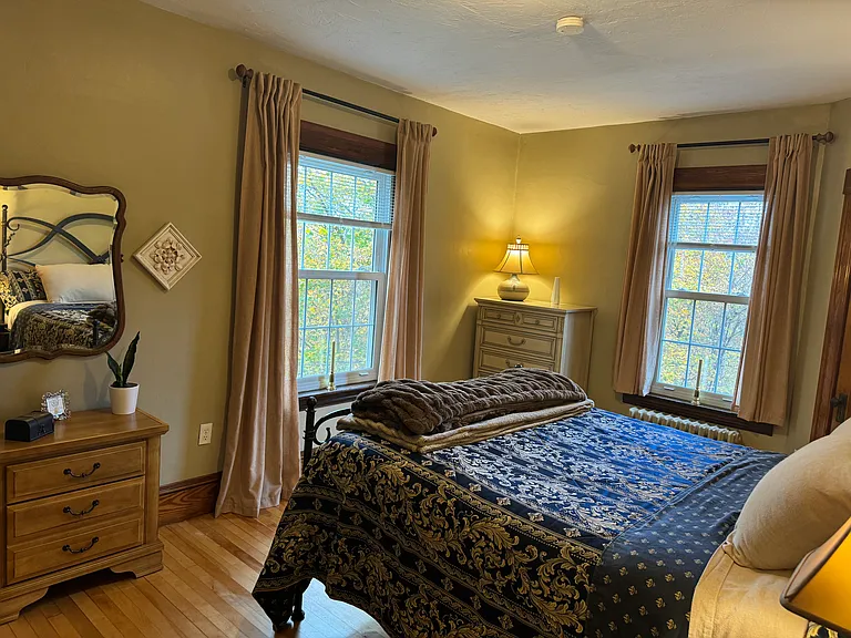 The large windows in the back bedroom flood the room with sunlight in the later afternoon. The mini blinds are room darkening mini blinds.