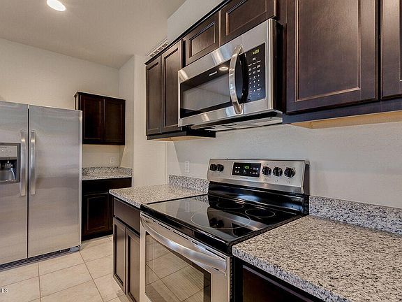 Kitchen with Smooth top Stainless Appliaces