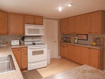 All newer cabinets & laminate flooring