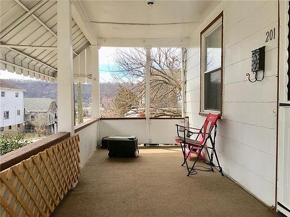 You will love relaxing on this spacious covered front porch overlooking the neighborhood
