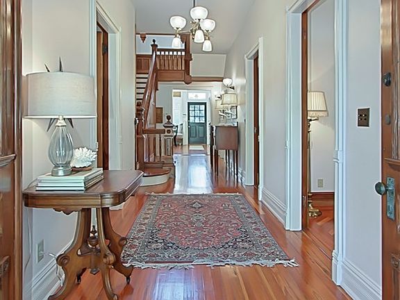 Foyer & Front Hallway with Heart of Pine Flooring. Period Reproduction Light Fixture.