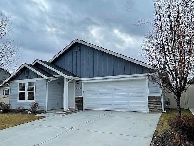 Front of home. Entry door and garage