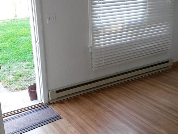 Front door/living room w/original hard wood floors2