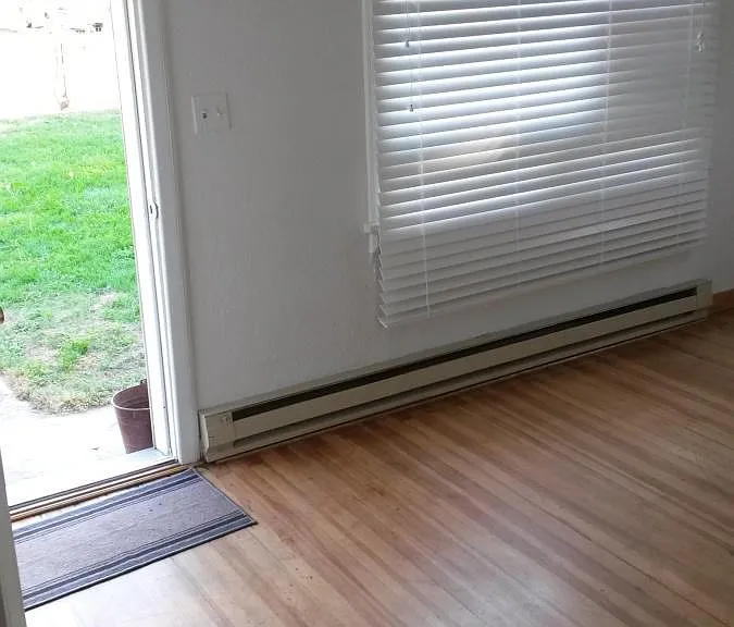 Front door/living room w/original hard wood floors2