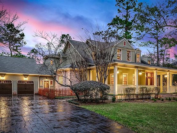 Large wrap around porch, double wide driveway, a kitchen/herb garden just outside the kitchen window, and charming curb appeal!