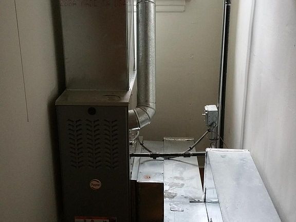High efficiency forced air heating unit