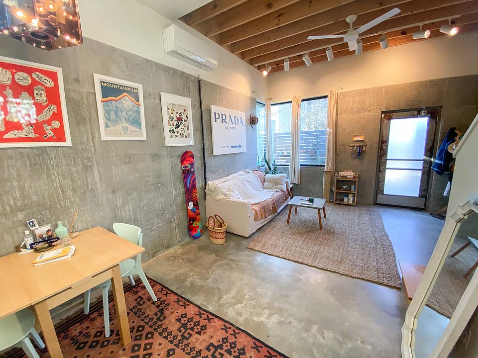 Living room and kitchen table in foreground