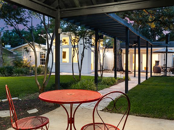 Room for a pool on this wonderful lot with stone pathways and Heritage Oaks