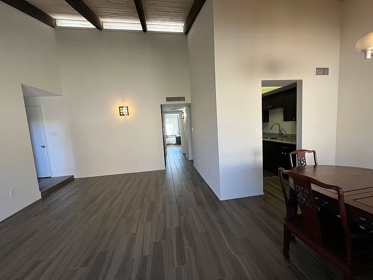 Your view from your living area at the entrance and into kitchen, and the hallway to 2 bathrooms and 2 bedrooms. 
Note. Dining table will be removed before your move-in.