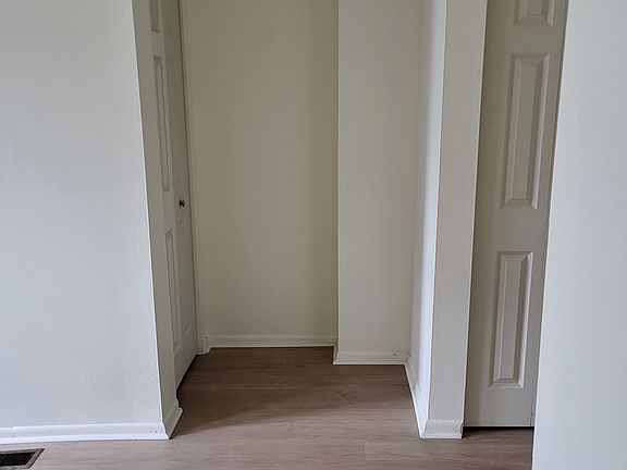 Closets on left is under stairs. Closet on right is across from bathroom.