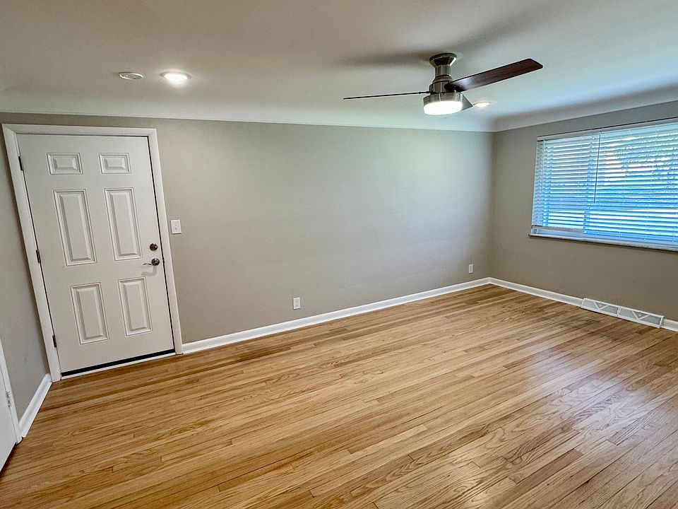 Living room features completely refinished genuine hardwood floors.