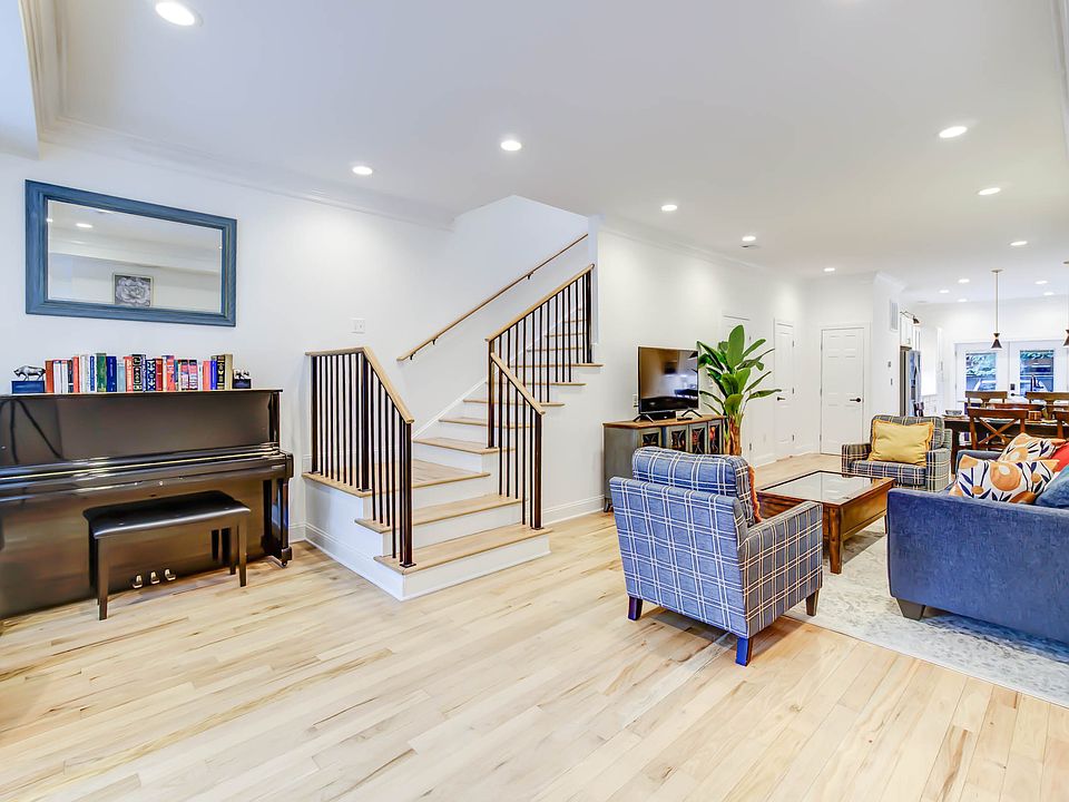 The staircase to the second floor is thoughtfully positioned near the front of the home, offering both convenience and a natural flow between levels.