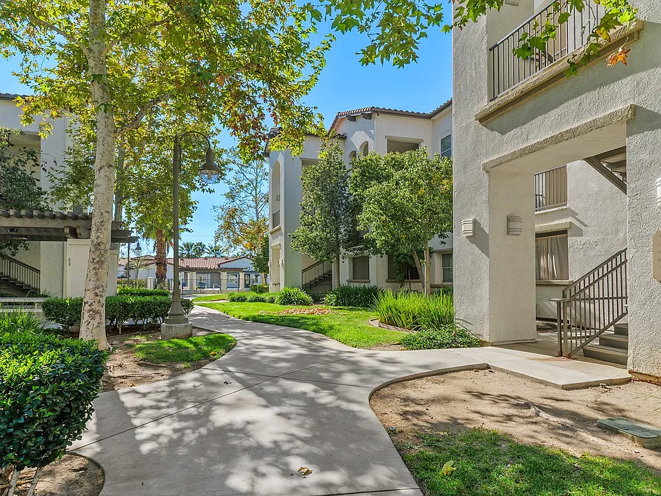 Lush landscaping and modern design create the perfect first impression.