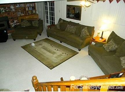 View of great room from stairs : Very spacious lower level great room with fire place, walkout to ba