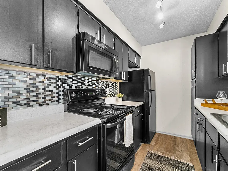 B1 Kitchen w/ Black Appliance Package & Tile Backsplash