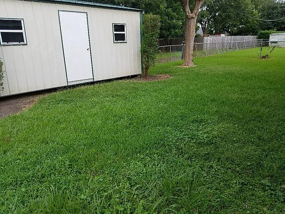 Fenced-in back yard with 10'x20' shed