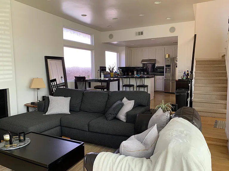 Looking at the living room, dining room, and kitchen.