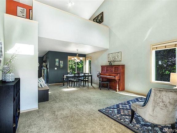 Dramatic 2 story entry takes you into the living room & dining room. At the top of the photo is the loft. 
