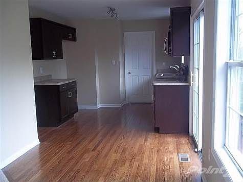 This view shows the walkout to the patio (right) and through the door to your 1st floor laundry room and easy access to the garage.