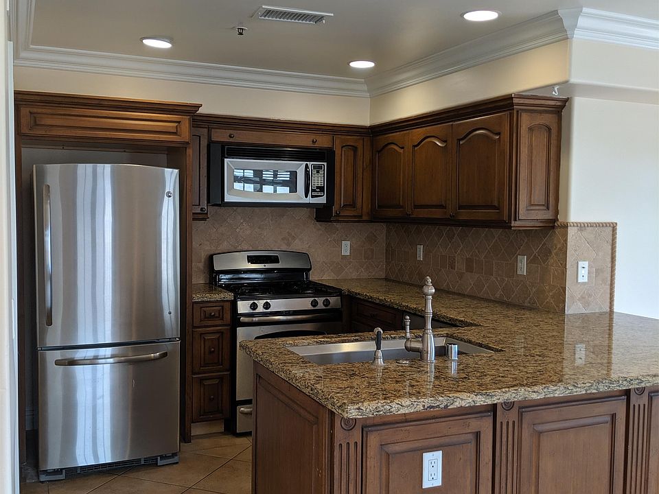 Entertaining kitchen features a breakfast bar overlooking your living area. Appliances included!