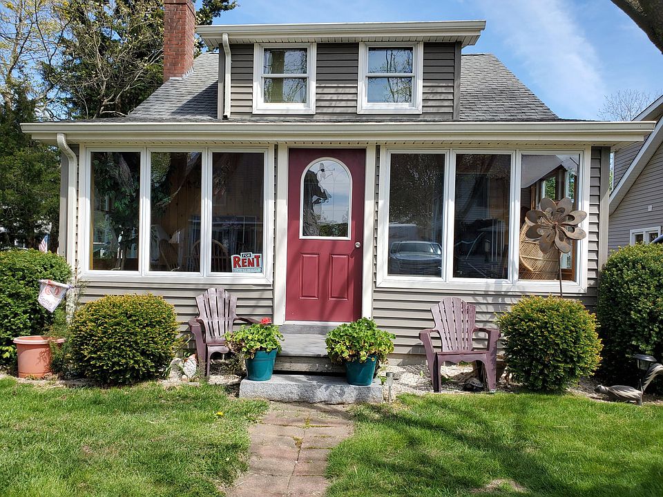 House is on a corner lot. Short walk to private beach.