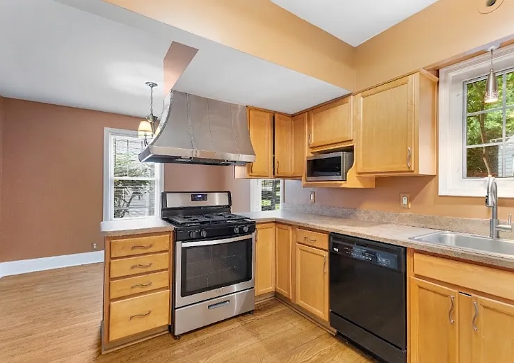 Plenty of counter space to prep your favorite meals in this functional kitchen layout.