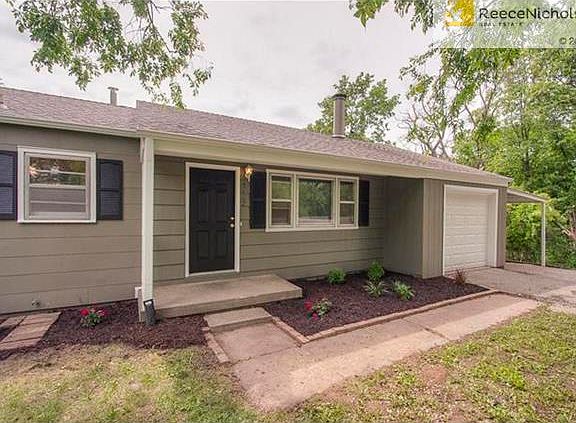 Beautiful new landscaping with an inviting and too cute porch. New black shutters add charm.