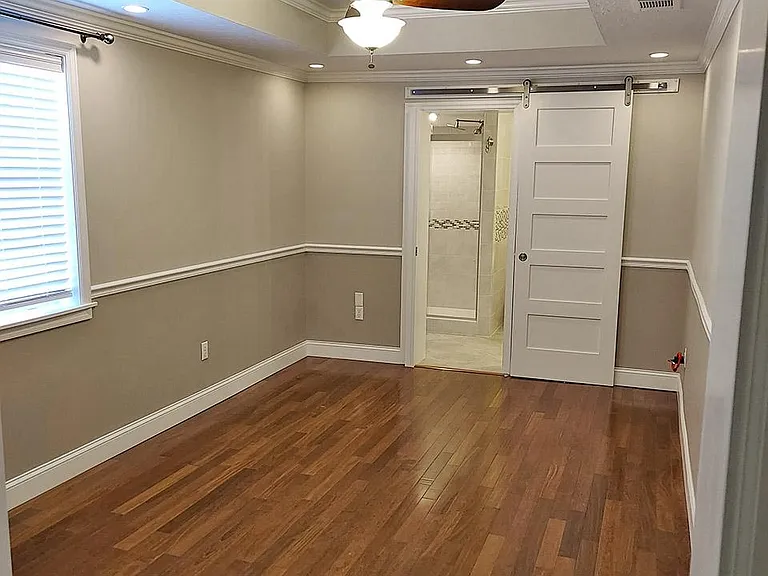 Master Bedroom looking towards the Master Bathroom with barn door