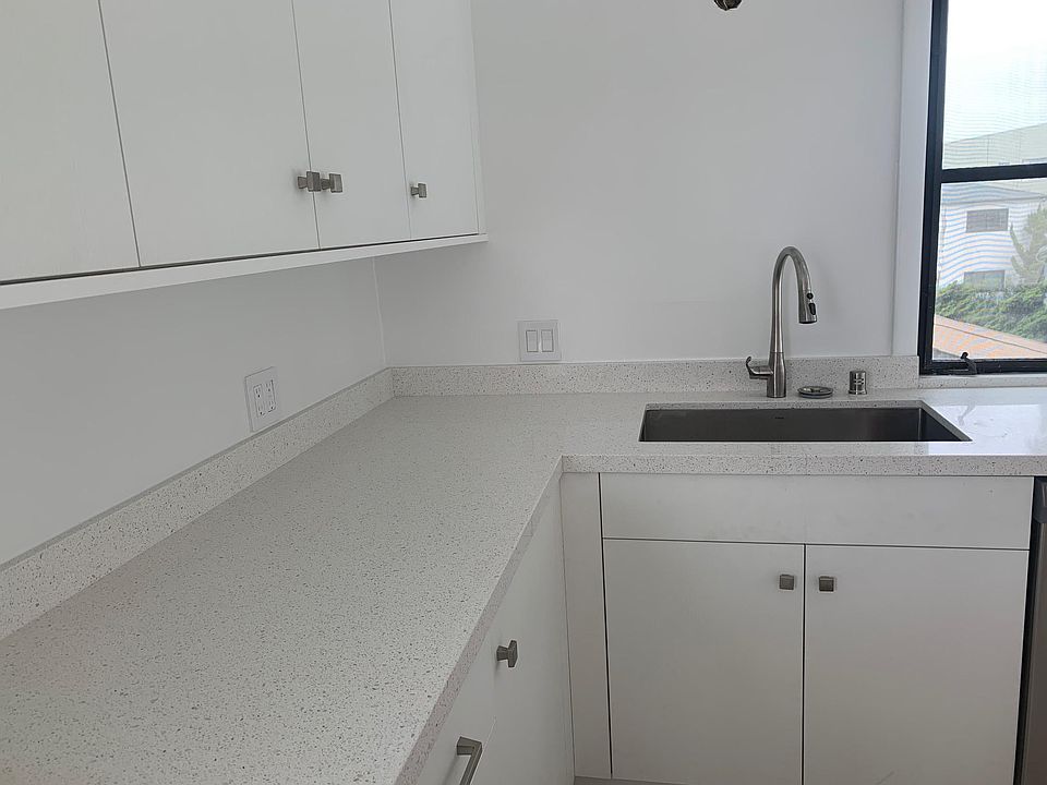 WEST AND NORTH SIDES OF KITCHEN