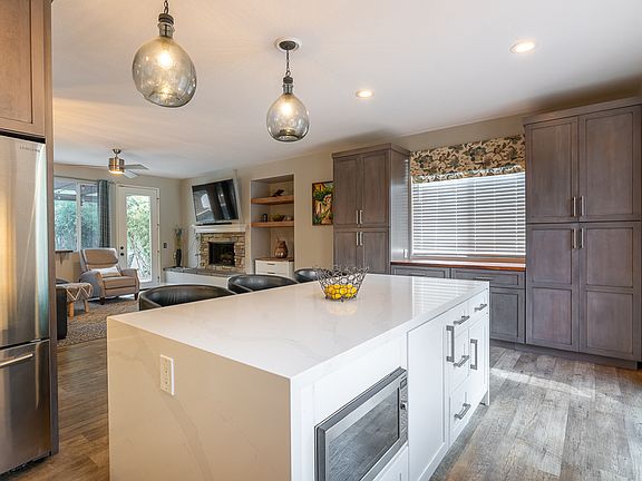 Plenty of cabinet space and built in microwave with separate range hood
