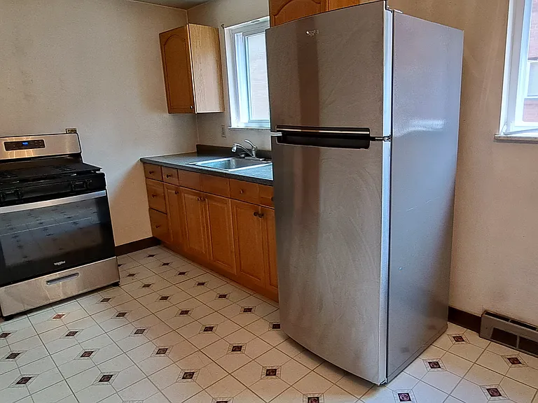 Large kitchen with range and 18cf refrigerator with top freezer
