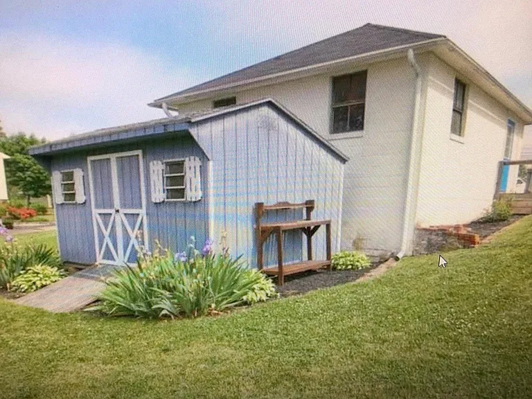 2 car detached garage and large shed.