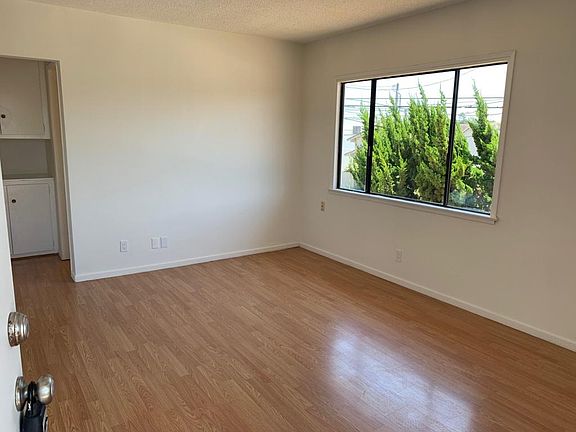 View when you enter apartment into large living room