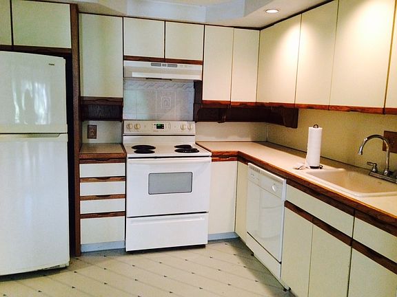 Light kitchen with matching appliances and overhead lighting