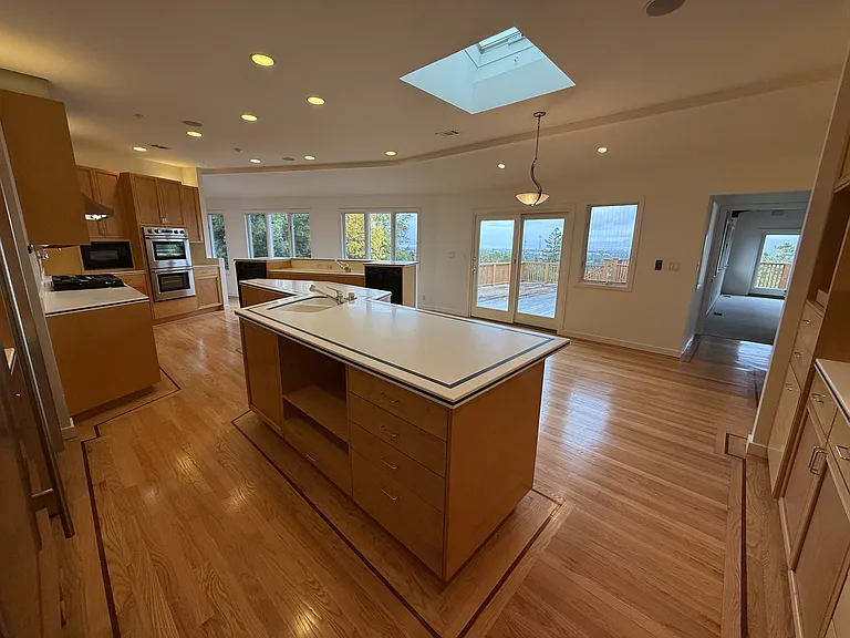 Chef's dream gourmet kitchen features two islands, freezer, refrigerator, two dishwashers, a pot-filler faucet and stainless-steel appliances.