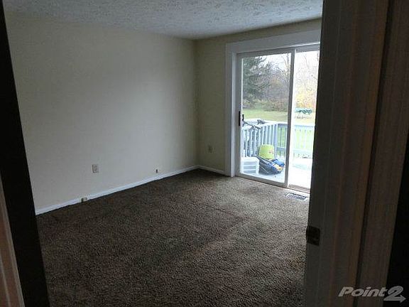 Rear Bedroom with entry to deck.