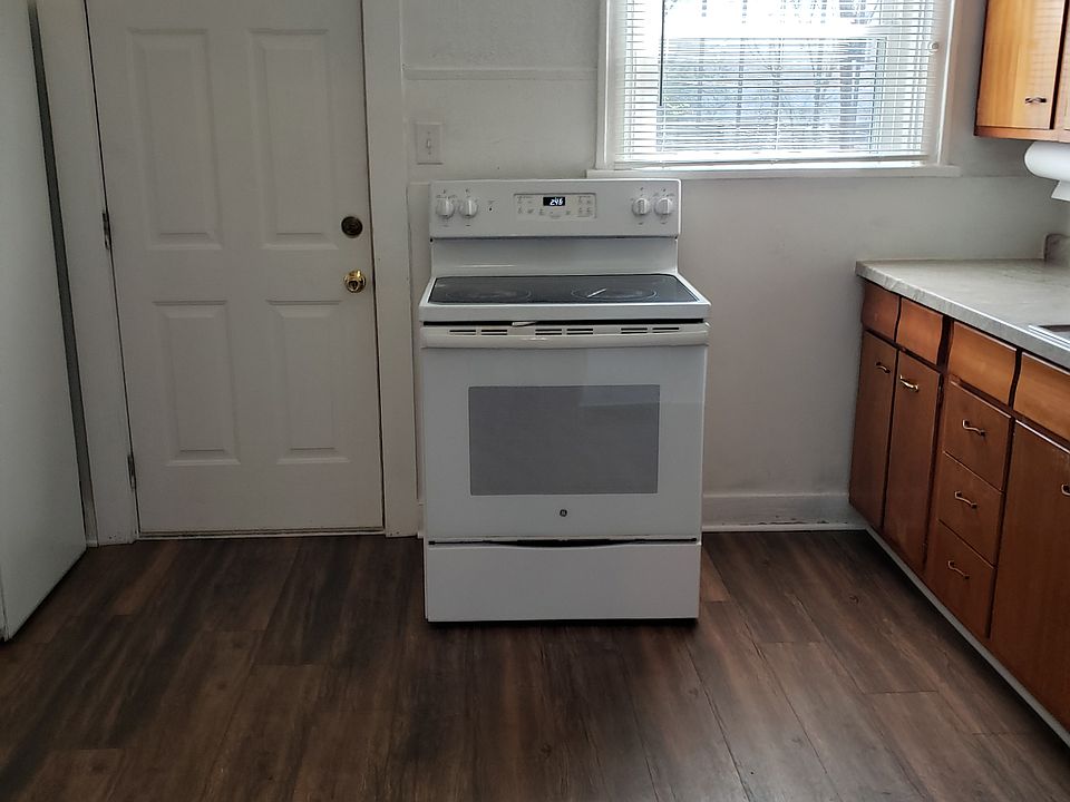 Kitchen, lots of cabinets, newer gas stove and refrigerator.