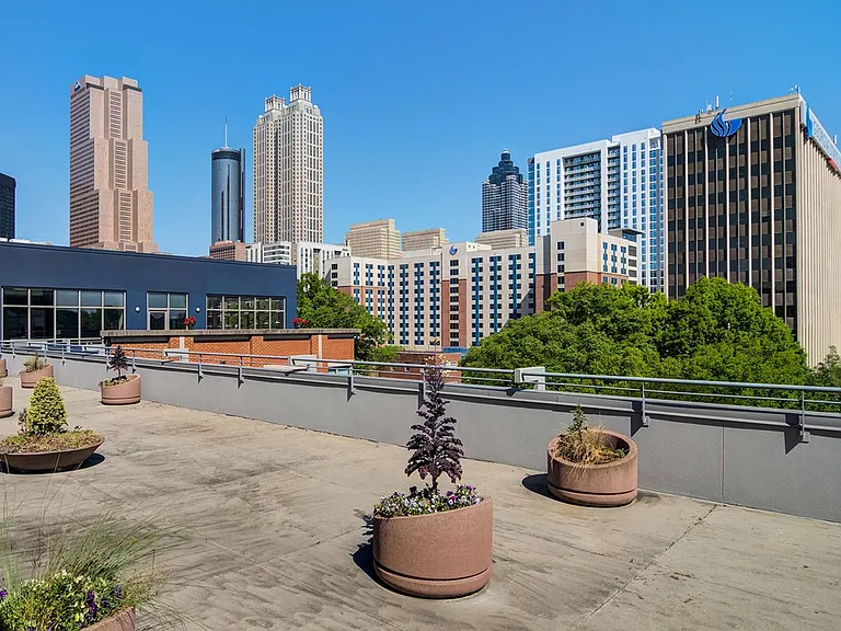 Spacious rooftop deck with skyline views