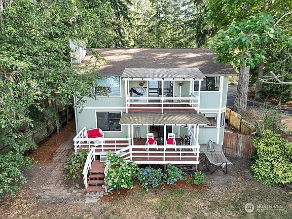 Two spacious view decks to take it all in - note there is room for a hot tub on the left - and another upper deck on other side of house>