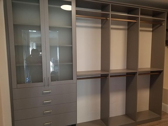 Very large walk in closet. Featuring California Closet design on three sides.